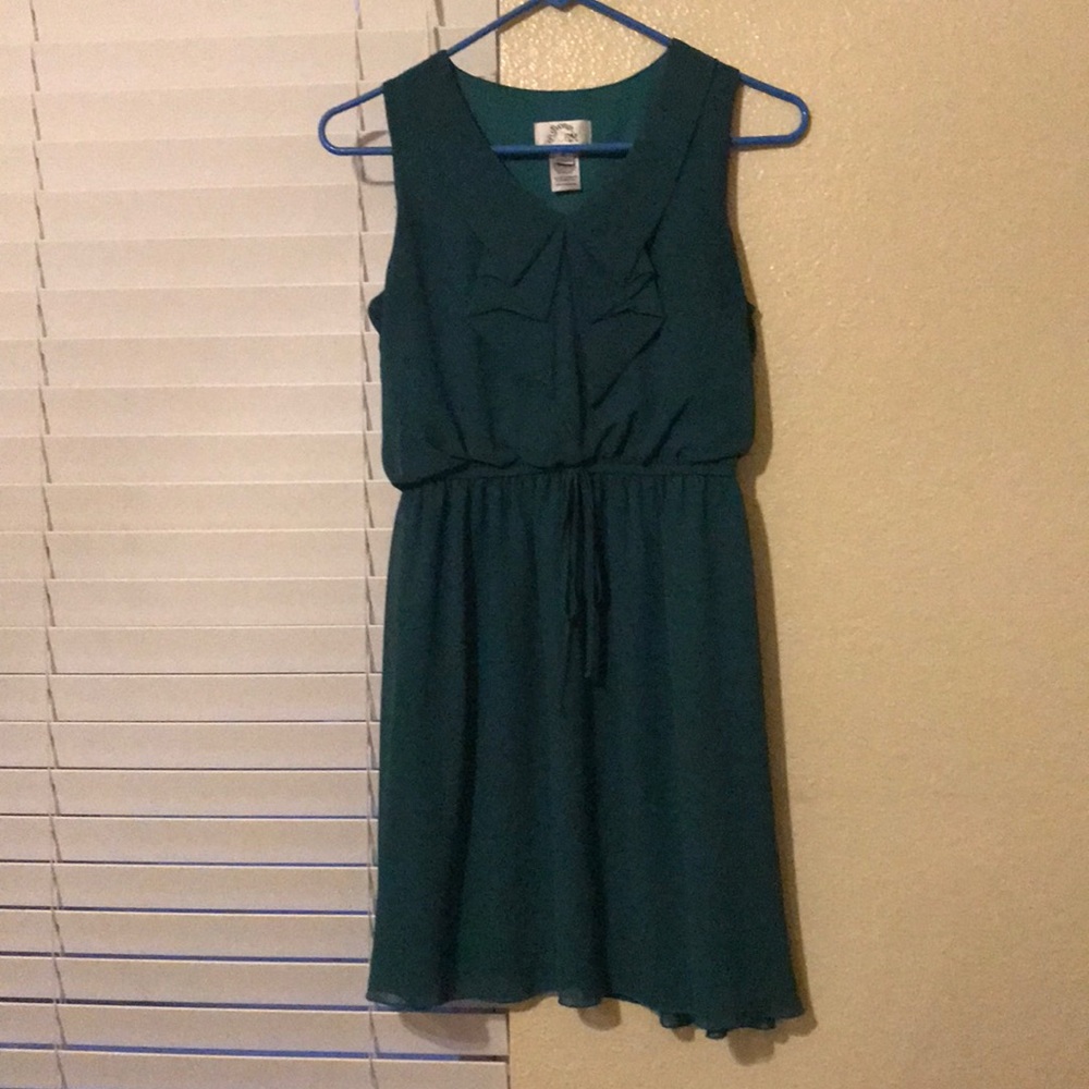 Teal, elastic waist band with bow on front. EUC